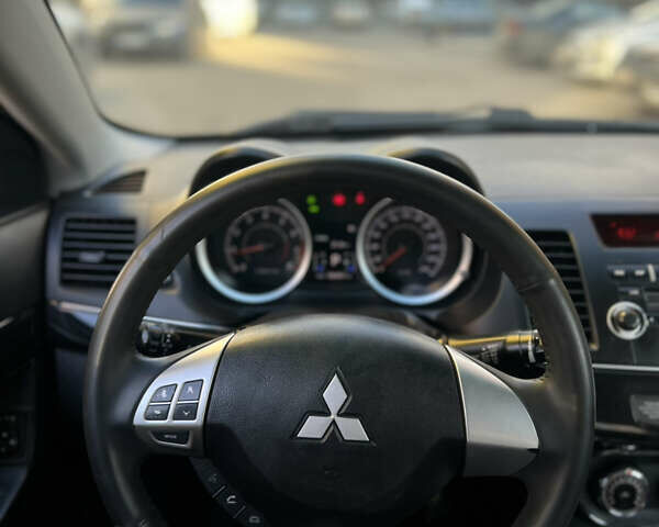 Черный Мицубиси Лансер, объемом двигателя 1.59 л и пробегом 186 тыс. км за 7300 $, фото 27 на Automoto.ua