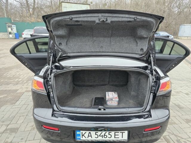 Черный Мицубиси Лансер, объемом двигателя 2 л и пробегом 223 тыс. км за 5500 $, фото 16 на Automoto.ua