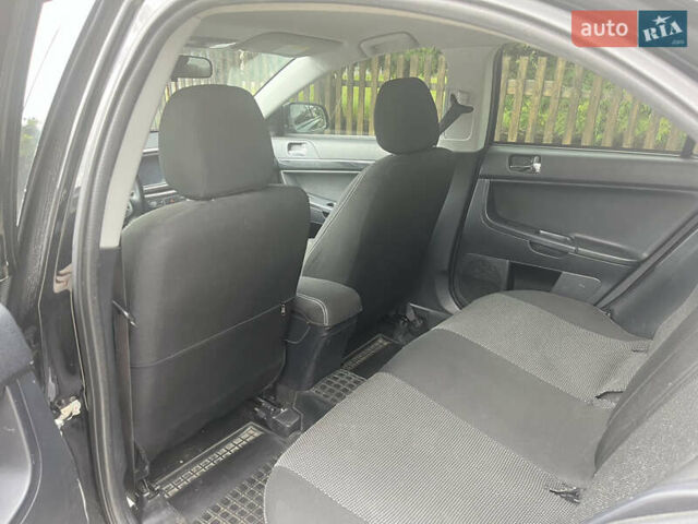 Черный Мицубиси Лансер, объемом двигателя 1.8 л и пробегом 224 тыс. км за 7300 $, фото 9 на Automoto.ua