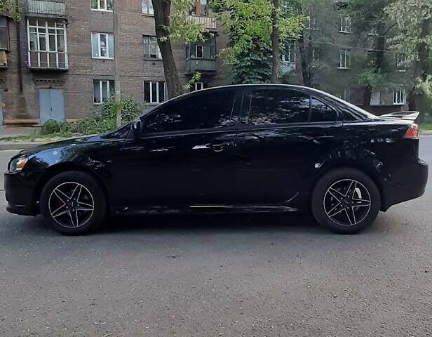 Чорний Міцубісі Lancer, об'ємом двигуна 1.6 л та пробігом 121 тис. км за 8999 $, фото 3 на Automoto.ua