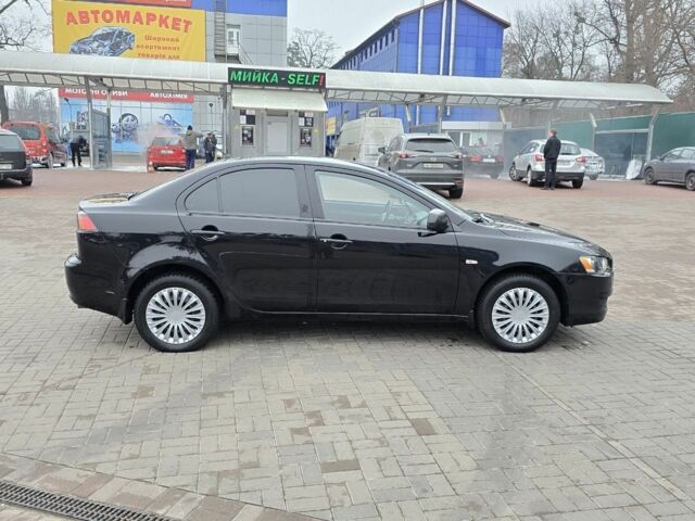 Черный Мицубиси Лансер, объемом двигателя 2 л и пробегом 223 тыс. км за 5500 $, фото 5 на Automoto.ua