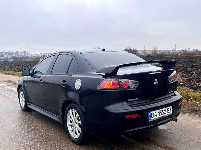 Чорний Міцубісі Lancer, об'ємом двигуна 2 л та пробігом 123 тис. км за 9000 $, фото 2 на Automoto.ua