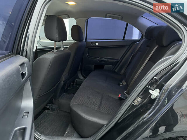 Черный Мицубиси Лансер, объемом двигателя 1.6 л и пробегом 216 тыс. км за 7200 $, фото 15 на Automoto.ua