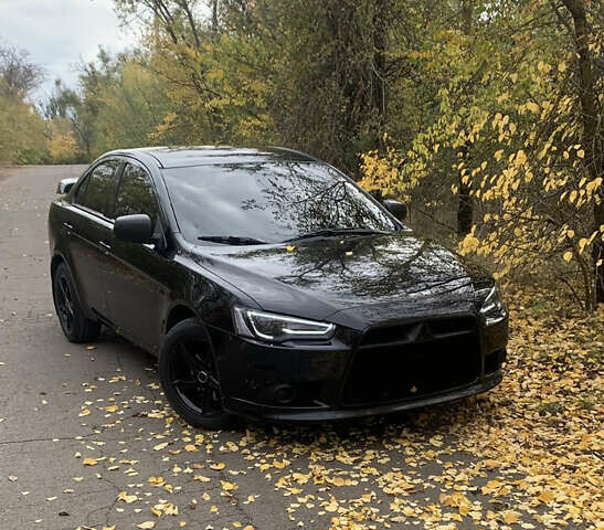 Черный Мицубиси Лансер, объемом двигателя 1.59 л и пробегом 122 тыс. км за 8000 $, фото 1 на Automoto.ua