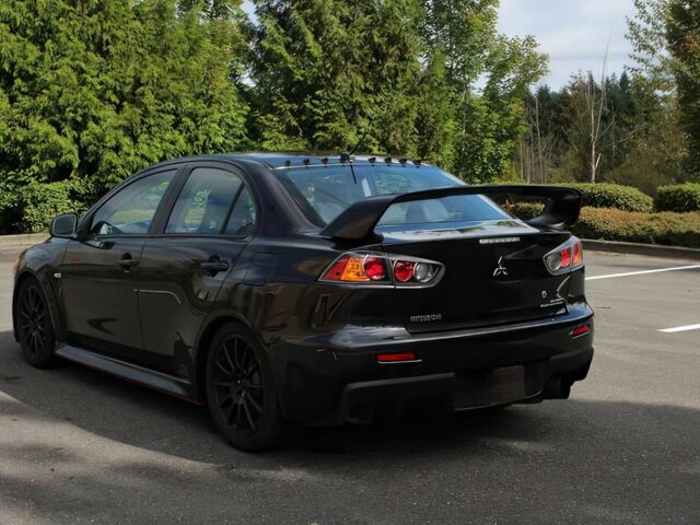 Чорний Міцубісі Lancer, об'ємом двигуна 2 л та пробігом 82 тис. км за 11000 $, фото 6 на Automoto.ua