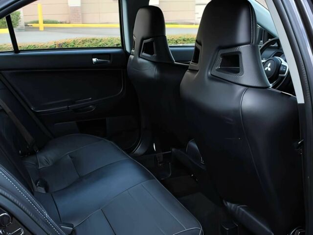 Чорний Міцубісі Lancer, об'ємом двигуна 2 л та пробігом 82 тис. км за 11000 $, фото 12 на Automoto.ua