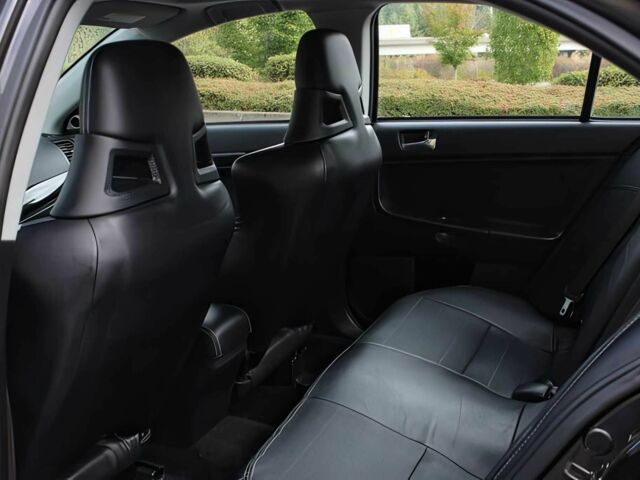 Чорний Міцубісі Lancer, об'ємом двигуна 2 л та пробігом 82 тис. км за 11000 $, фото 11 на Automoto.ua