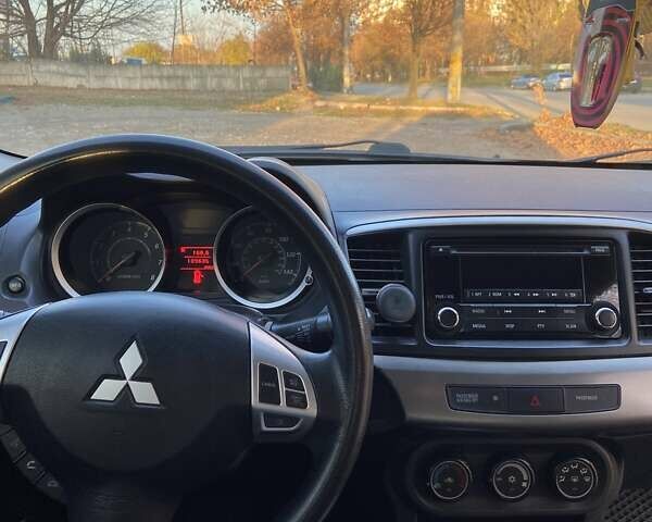 Черный Мицубиси Лансер, объемом двигателя 2 л и пробегом 175 тыс. км за 9200 $, фото 4 на Automoto.ua