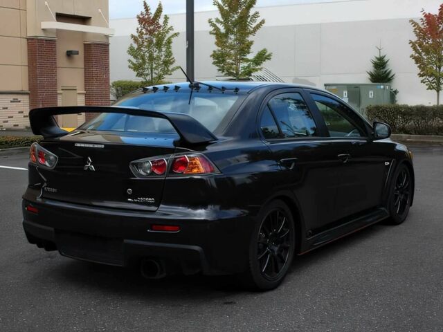 Чорний Міцубісі Lancer, об'ємом двигуна 2 л та пробігом 82 тис. км за 11000 $, фото 4 на Automoto.ua