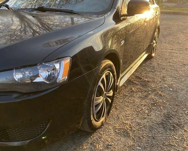 Черный Мицубиси Лансер, объемом двигателя 2 л и пробегом 175 тыс. км за 9200 $, фото 1 на Automoto.ua