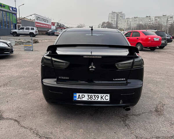Черный Мицубиси Лансер, объемом двигателя 2 л и пробегом 156 тыс. км за 8999 $, фото 4 на Automoto.ua