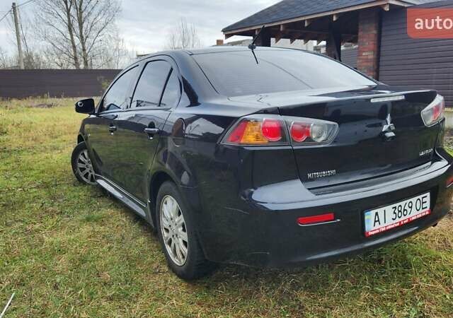 Чорний Міцубісі Lancer, об'ємом двигуна 2 л та пробігом 127 тис. км за 9600 $, фото 7 на Automoto.ua