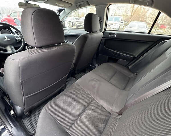 Черный Мицубиси Лансер, объемом двигателя 2 л и пробегом 156 тыс. км за 8999 $, фото 10 на Automoto.ua