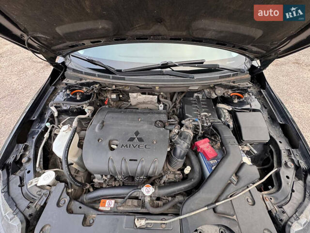 Черный Мицубиси Лансер, объемом двигателя 2 л и пробегом 156 тыс. км за 8999 $, фото 15 на Automoto.ua