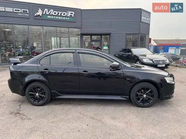 Черный Мицубиси Лансер, объемом двигателя 2 л и пробегом 156 тыс. км за 8999 $, фото 6 на Automoto.ua