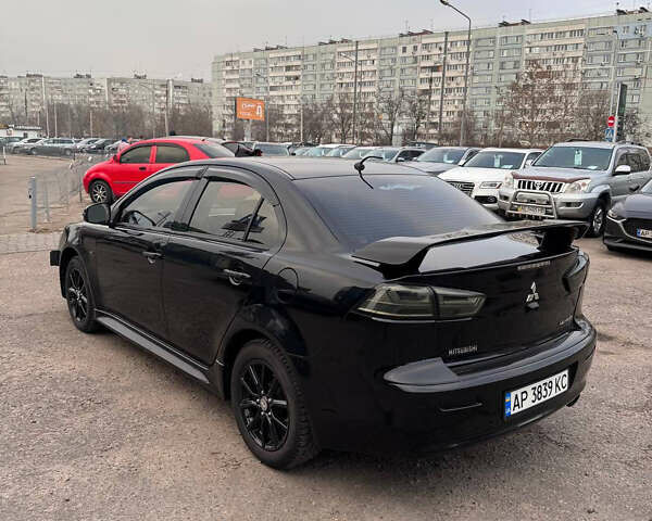 Черный Мицубиси Лансер, объемом двигателя 2 л и пробегом 156 тыс. км за 8999 $, фото 3 на Automoto.ua