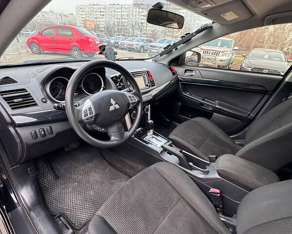 Черный Мицубиси Лансер, объемом двигателя 2 л и пробегом 156 тыс. км за 8999 $, фото 8 на Automoto.ua