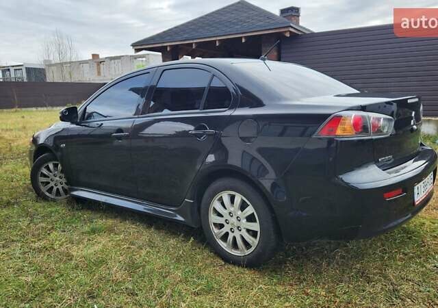 Чорний Міцубісі Lancer, об'ємом двигуна 2 л та пробігом 127 тис. км за 9600 $, фото 9 на Automoto.ua
