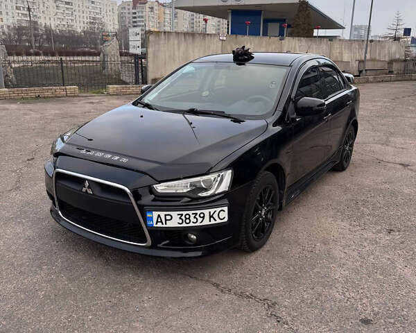 Черный Мицубиси Лансер, объемом двигателя 2 л и пробегом 156 тыс. км за 8999 $, фото 1 на Automoto.ua