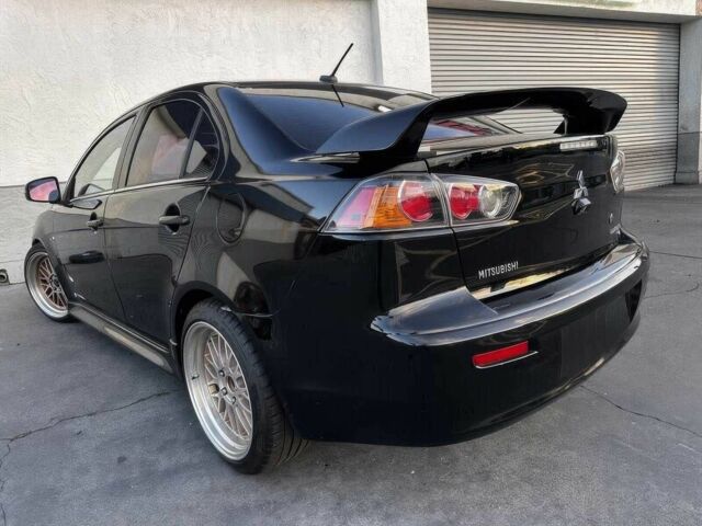 Черный Мицубиси Лансер, объемом двигателя 2.4 л и пробегом 76 тыс. км за 9200 $, фото 4 на Automoto.ua