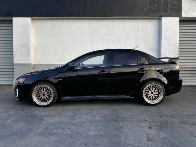 Черный Мицубиси Лансер, объемом двигателя 2.4 л и пробегом 76 тыс. км за 9200 $, фото 3 на Automoto.ua