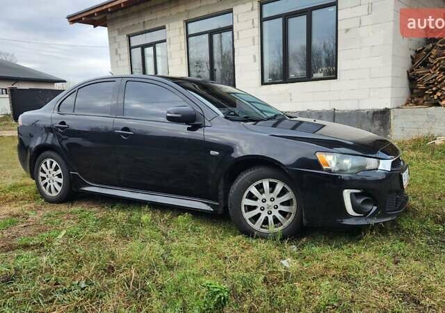 Чорний Міцубісі Lancer, об'ємом двигуна 2 л та пробігом 127 тис. км за 9600 $, фото 4 на Automoto.ua