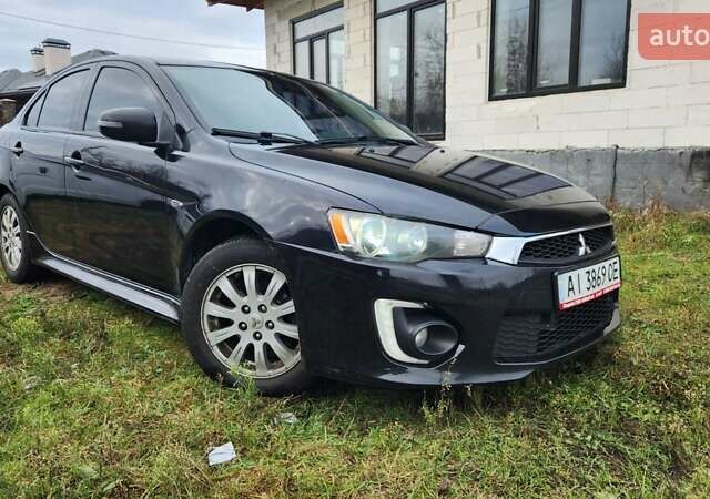 Чорний Міцубісі Lancer, об'ємом двигуна 2 л та пробігом 127 тис. км за 9600 $, фото 3 на Automoto.ua