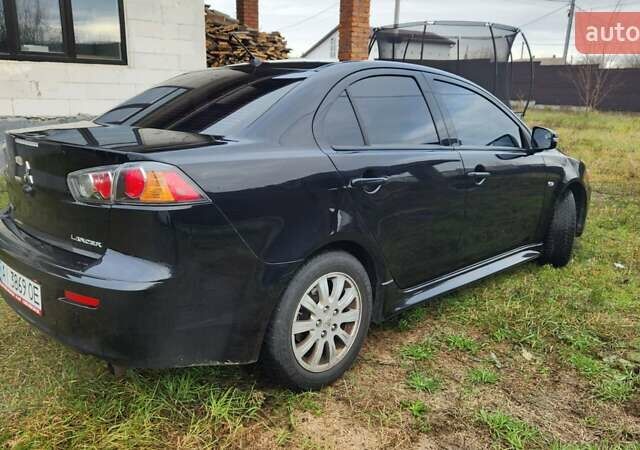Чорний Міцубісі Lancer, об'ємом двигуна 2 л та пробігом 127 тис. км за 9600 $, фото 5 на Automoto.ua