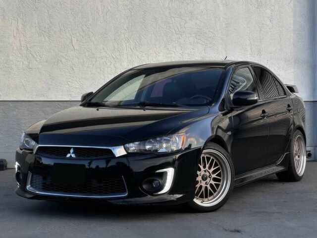 Черный Мицубиси Лансер, объемом двигателя 2.4 л и пробегом 76 тыс. км за 9200 $, фото 2 на Automoto.ua