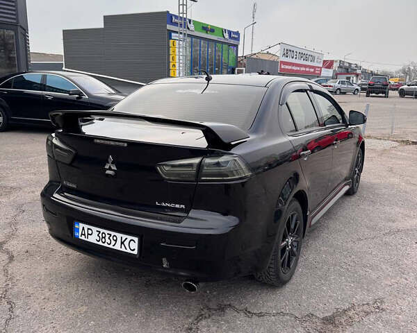 Черный Мицубиси Лансер, объемом двигателя 2 л и пробегом 156 тыс. км за 8999 $, фото 5 на Automoto.ua