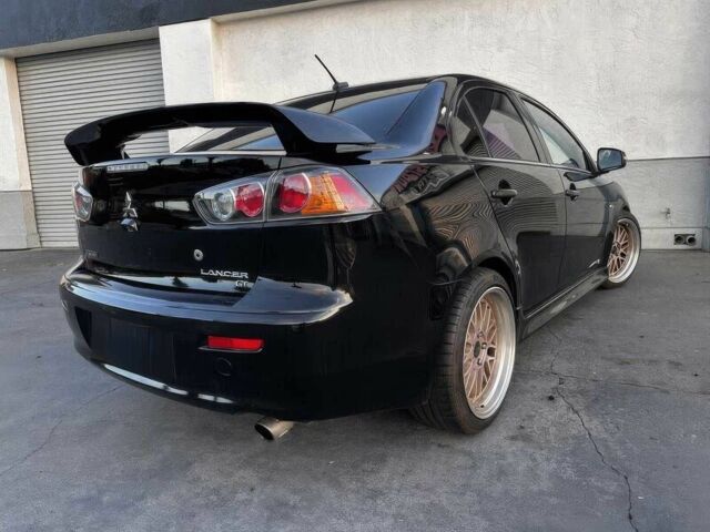 Черный Мицубиси Лансер, объемом двигателя 2.4 л и пробегом 76 тыс. км за 9200 $, фото 6 на Automoto.ua