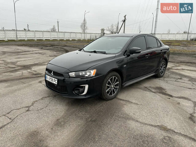 Черный Мицубиси Лансер, объемом двигателя 2 л и пробегом 142 тыс. км за 9500 $, фото 1 на Automoto.ua