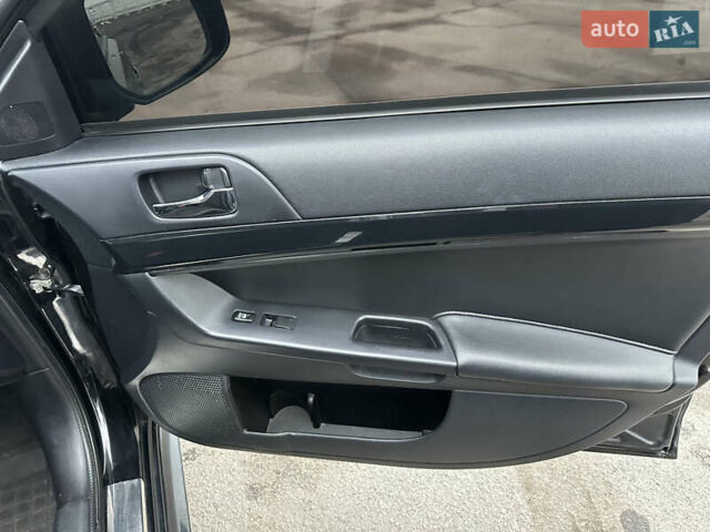 Черный Мицубиси Лансер, объемом двигателя 2 л и пробегом 142 тыс. км за 9500 $, фото 12 на Automoto.ua