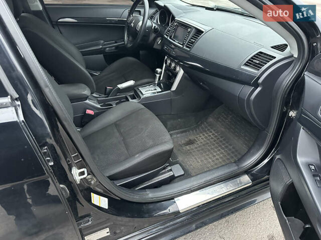 Черный Мицубиси Лансер, объемом двигателя 2 л и пробегом 142 тыс. км за 9500 $, фото 10 на Automoto.ua