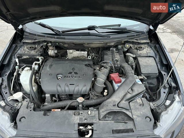 Черный Мицубиси Лансер, объемом двигателя 2 л и пробегом 142 тыс. км за 9500 $, фото 42 на Automoto.ua