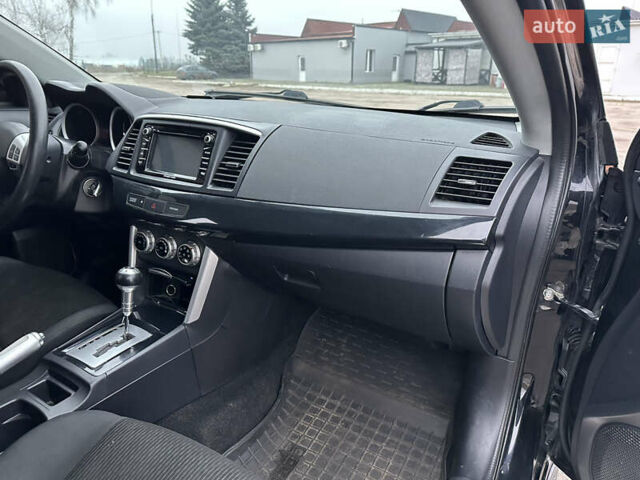 Черный Мицубиси Лансер, объемом двигателя 2 л и пробегом 142 тыс. км за 9500 $, фото 11 на Automoto.ua