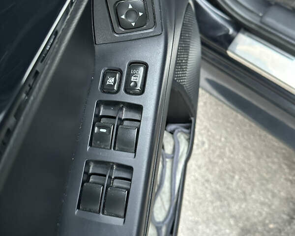 Черный Мицубиси Лансер, объемом двигателя 2 л и пробегом 142 тыс. км за 9500 $, фото 8 на Automoto.ua