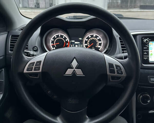 Черный Мицубиси Лансер, объемом двигателя 2 л и пробегом 142 тыс. км за 9500 $, фото 26 на Automoto.ua