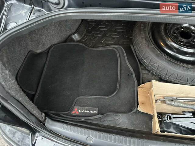 Черный Мицубиси Лансер, объемом двигателя 2 л и пробегом 142 тыс. км за 9500 $, фото 36 на Automoto.ua