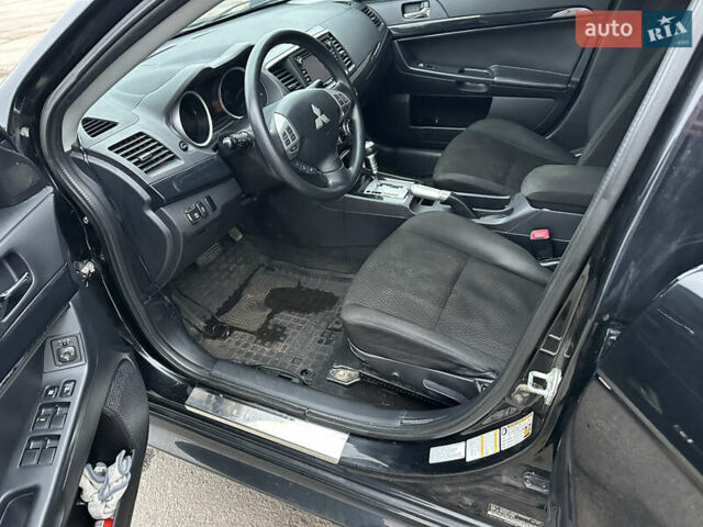 Черный Мицубиси Лансер, объемом двигателя 2 л и пробегом 142 тыс. км за 9500 $, фото 6 на Automoto.ua