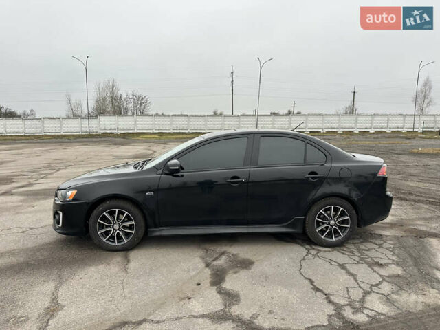 Черный Мицубиси Лансер, объемом двигателя 2 л и пробегом 142 тыс. км за 9500 $, фото 2 на Automoto.ua