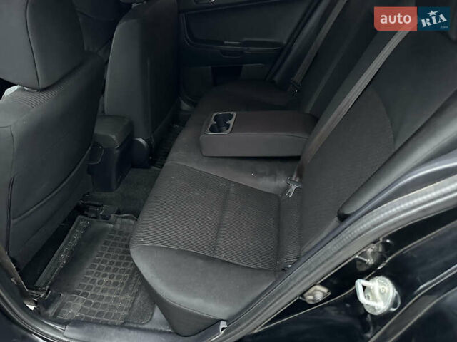 Черный Мицубиси Лансер, объемом двигателя 2 л и пробегом 142 тыс. км за 9500 $, фото 13 на Automoto.ua