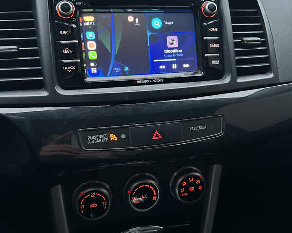 Черный Мицубиси Лансер, объемом двигателя 2 л и пробегом 142 тыс. км за 9500 $, фото 21 на Automoto.ua