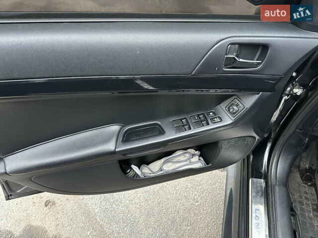 Черный Мицубиси Лансер, объемом двигателя 2 л и пробегом 142 тыс. км за 9500 $, фото 7 на Automoto.ua