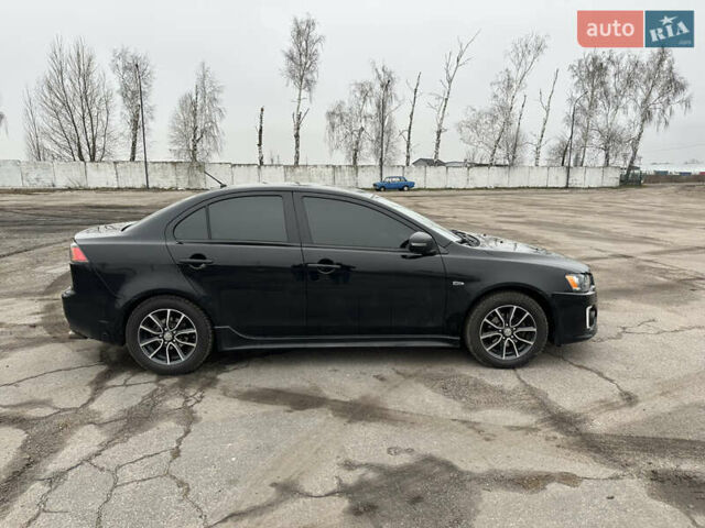 Черный Мицубиси Лансер, объемом двигателя 2 л и пробегом 142 тыс. км за 9500 $, фото 4 на Automoto.ua