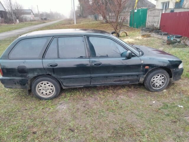 Черный Мицубиси Лансер, объемом двигателя 2 л и пробегом 380 тыс. км за 800 $, фото 5 на Automoto.ua