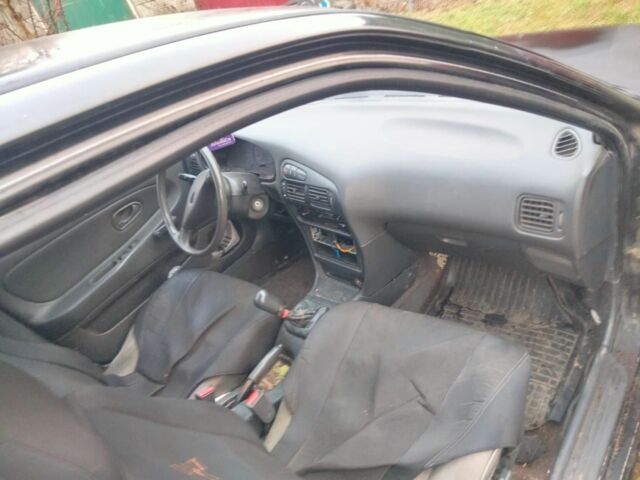 Черный Мицубиси Лансер, объемом двигателя 2 л и пробегом 380 тыс. км за 800 $, фото 2 на Automoto.ua