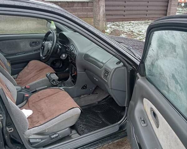 Чорний Міцубісі Lancer, об'ємом двигуна 2 л та пробігом 166 тис. км за 1699 $, фото 5 на Automoto.ua