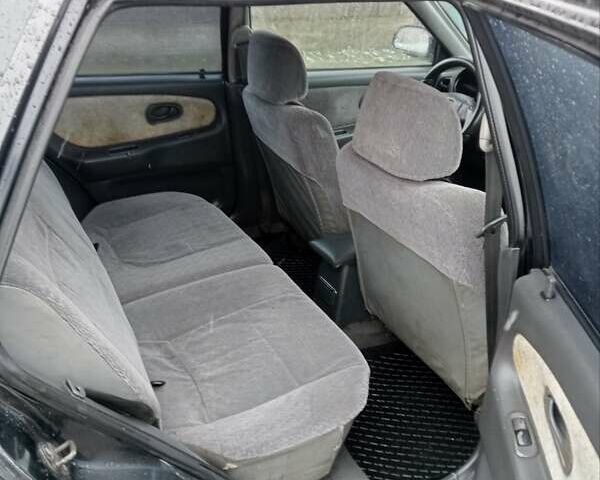 Чорний Міцубісі Lancer, об'ємом двигуна 2 л та пробігом 166 тис. км за 1699 $, фото 6 на Automoto.ua