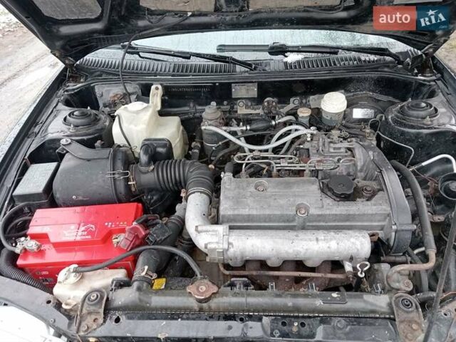 Чорний Міцубісі Lancer, об'ємом двигуна 2 л та пробігом 166 тис. км за 1699 $, фото 10 на Automoto.ua